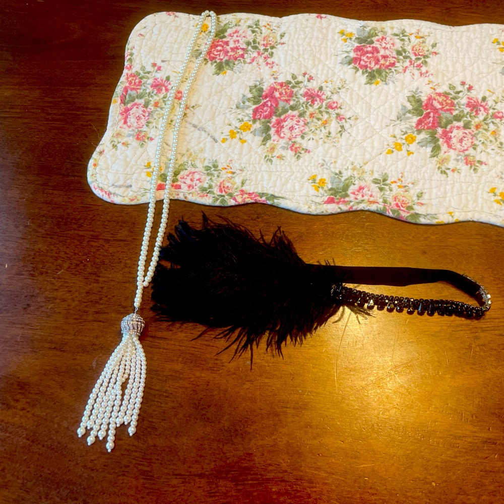 1920s flapper headpiece with sequins and feather and long faux pearl necklace